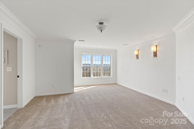 carpeted empty room with crown molding