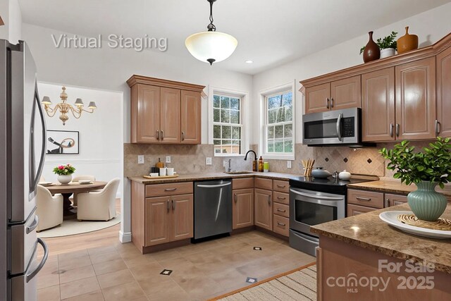 5774 Crown Ter, Hickory, NC 28601 - kitchen with appliances with stainless steel finishes, a sink, decorative light fixtures, backsplash, and recessed lighting