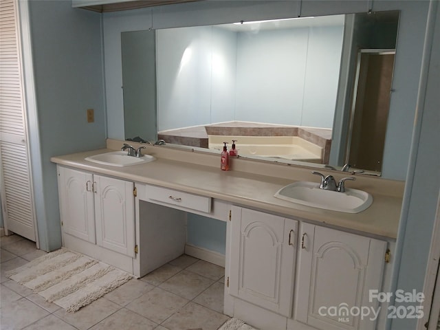 bathroom with vanity and tile patterned floors