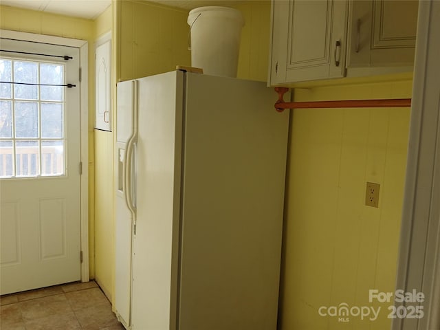 interior space featuring white refrigerator with ice dispenser