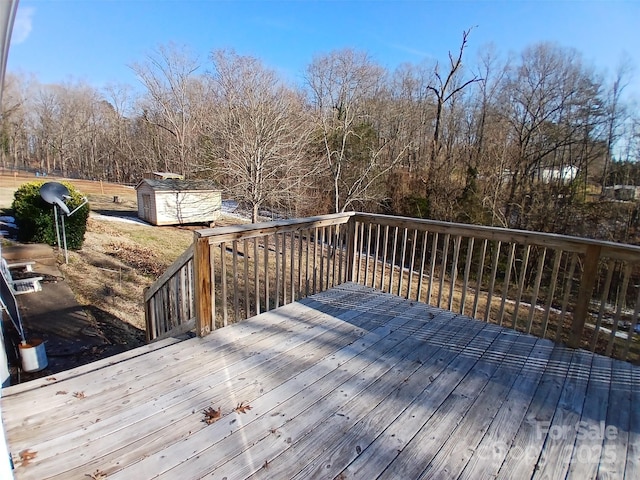 wooden terrace with a storage shed