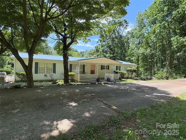 311 Coopers Gap Rd, Rutherfordton, NC 28139 - manufactured / mobile home with a porch, driveway, and metal roof