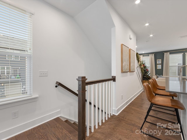 staircase featuring wood-type flooring