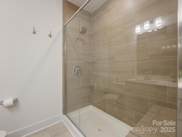 bathroom with tile patterned flooring and an enclosed shower