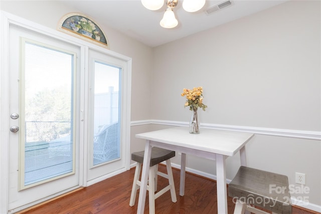 dining room featuring dark wood-type flooring