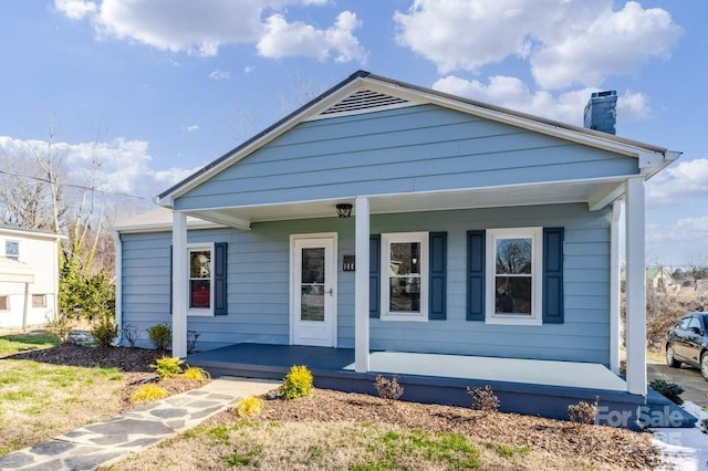 view of front of property featuring covered porch