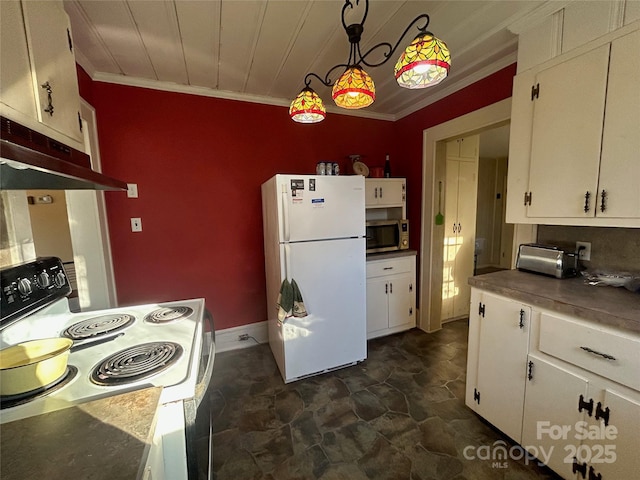 kitchen with stainless steel microwave, hanging light fixtures, freestanding refrigerator, white cabinetry, and range with electric cooktop