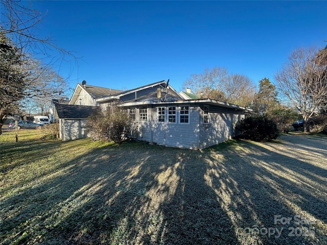 view of home's exterior featuring a lawn