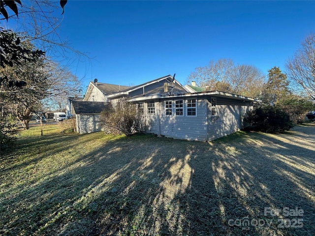 exterior space with a yard and driveway