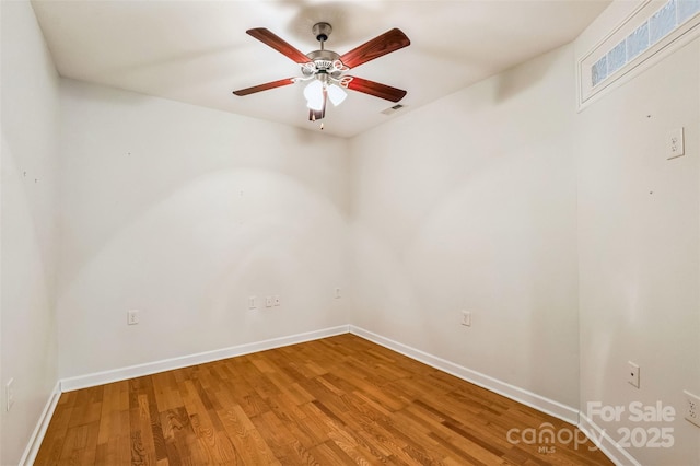 empty room featuring hardwood / wood-style floors and ceiling fan