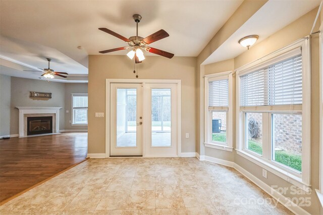 629 Cordova Ct, Salisbury, NC 28146 - entryway with a ceiling fan, healthy amount of natural light, a fireplace, lofted ceiling, and baseboards