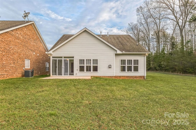 629 Cordova Ct, Salisbury, NC 28146 - back of property featuring central AC unit, a sunroom, a yard, and a shingled roof