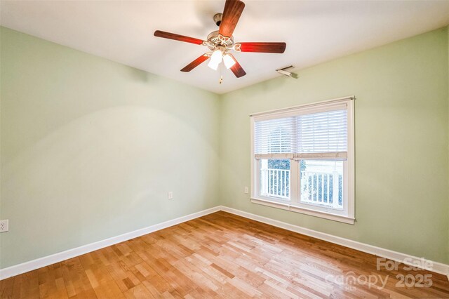 629 Cordova Ct, Salisbury, NC 28146 - unfurnished room with baseboards, light wood finished floors, and ceiling fan