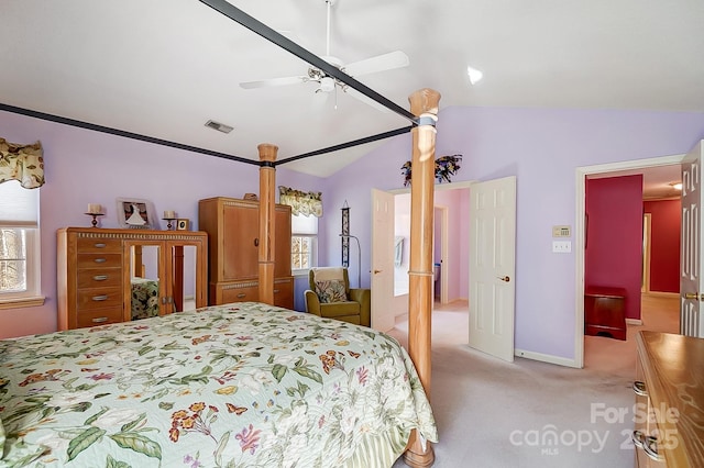 bedroom featuring ceiling fan, light colored carpet, and vaulted ceiling