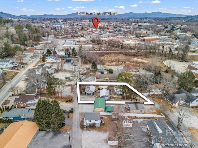 drone / aerial view featuring a mountain view