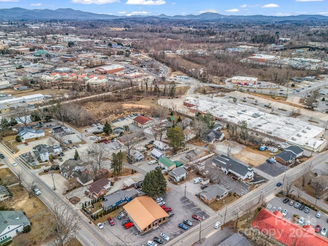 birds eye view of property with a mountain view