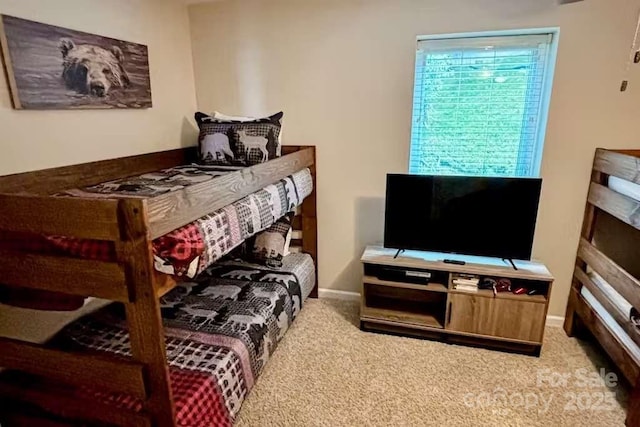 bedroom featuring light colored carpet