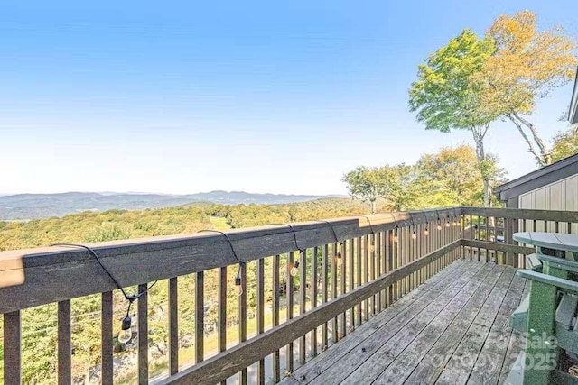 wooden terrace with a mountain view