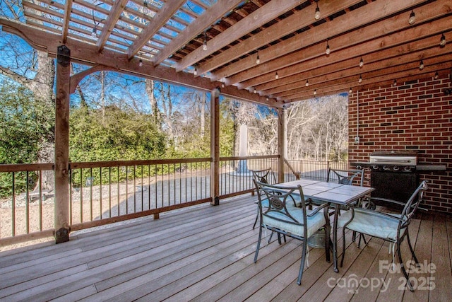 wooden terrace featuring area for grilling