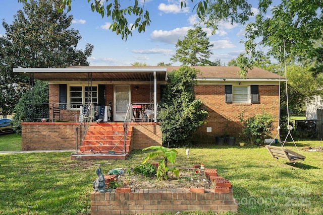 view of front of home featuring covered porch and a front lawn