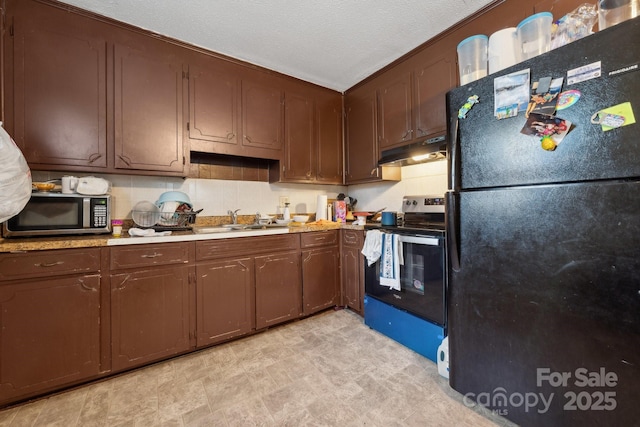 kitchen with black refrigerator, sink, electric range, dark brown cabinetry, and a textured ceiling