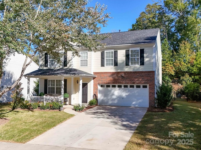 view of front of property featuring a garage, covered porch, and a front lawn