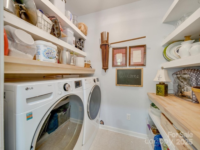 clothes washing area with washer and dryer