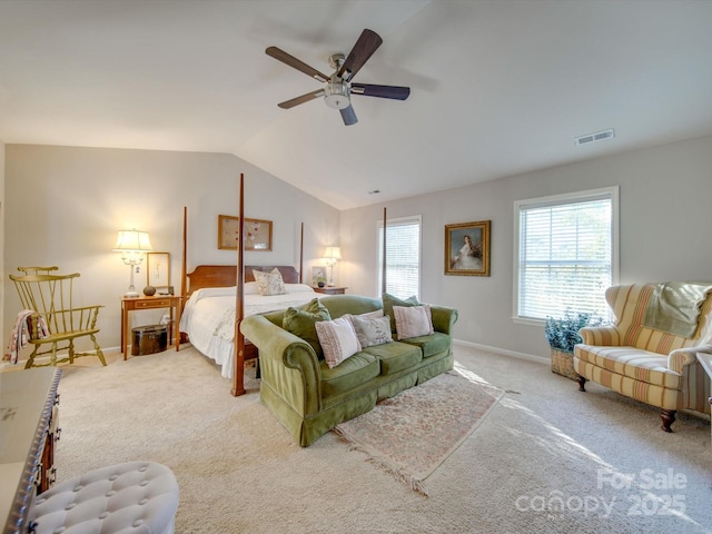 bedroom with light carpet, vaulted ceiling, and ceiling fan