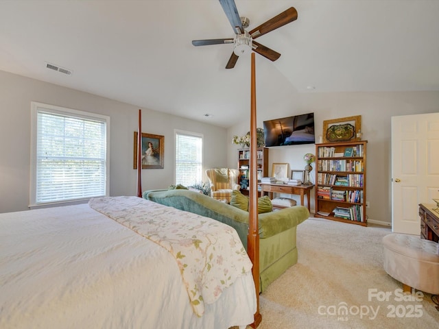 carpeted bedroom with lofted ceiling and ceiling fan