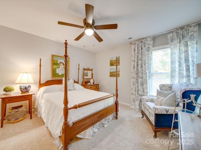 bedroom featuring ceiling fan and light carpet