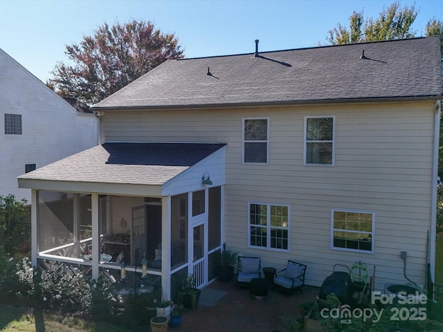 back of property featuring a sunroom