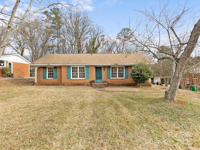 ranch-style home featuring a front yard