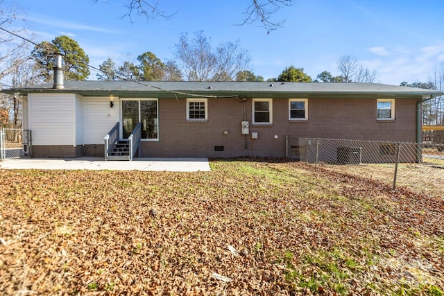 back of house featuring a yard and a patio