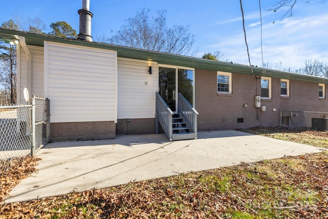 back of property featuring a patio area