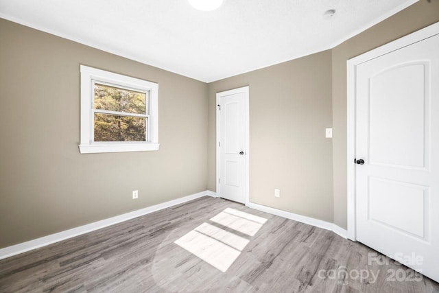 unfurnished bedroom featuring wood-type flooring