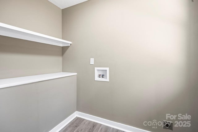 laundry area featuring a textured ceiling, hookup for an electric dryer, wood-type flooring, and washer hookup