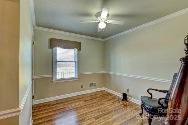 unfurnished room with light wood-type flooring, ceiling fan, and crown molding