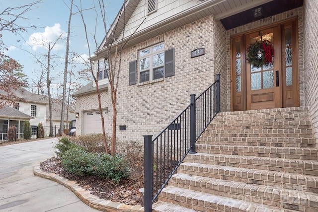 view of exterior entry featuring a garage