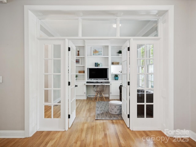 doorway to outside with light wood-type flooring and french doors