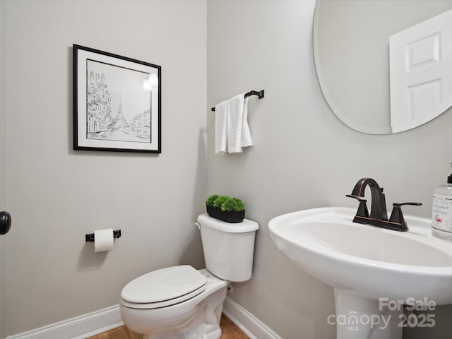 bathroom with toilet and sink