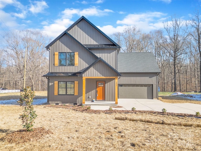 modern inspired farmhouse with a porch and a garage