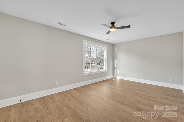 unfurnished room featuring ceiling fan and light wood-type flooring