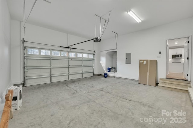 garage featuring a garage door opener and electric panel