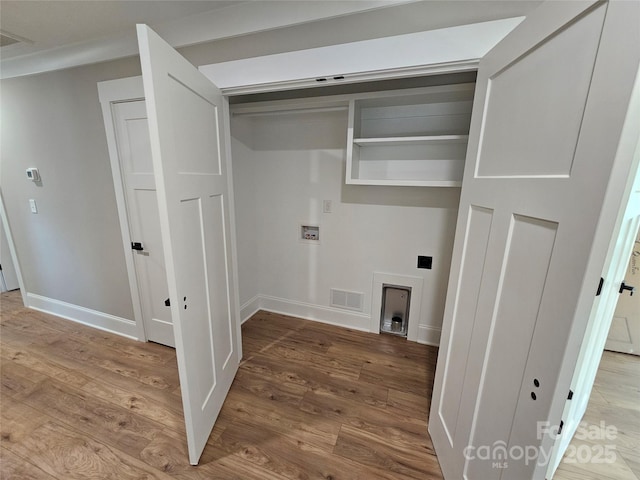 laundry area with washer hookup and hardwood / wood-style floors