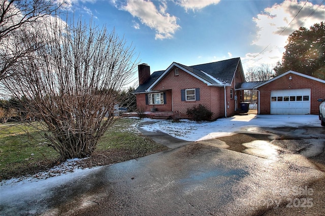 view of snowy exterior with a garage