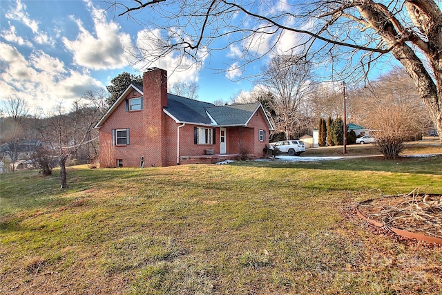 view of side of home featuring a lawn