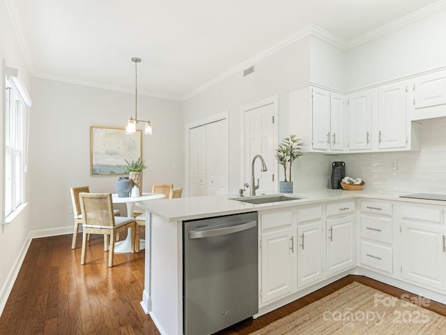 kitchen featuring decorative light fixtures, white cabinetry, dishwasher, sink, and dark hardwood / wood-style flooring