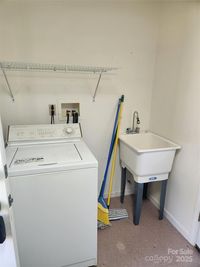 clothes washing area featuring washer / dryer