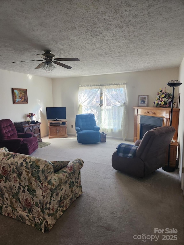 carpeted living room with a textured ceiling and ceiling fan