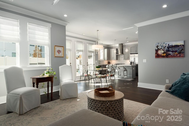 living room featuring ornamental molding and hardwood / wood-style floors